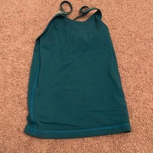 Ivivvia blue tank top. Size kids 4, but stretch’s to a 7.